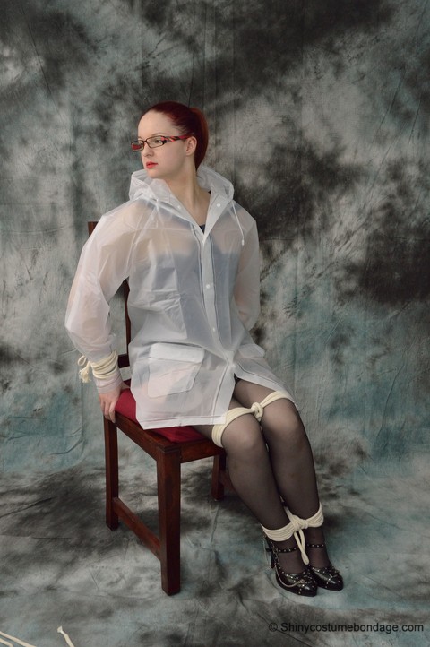 Redheaded chick in a raincoat and glasses gets tied up and gagged | Фото 4