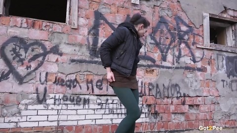 Caucasian girl pulls down her tights for a piss behind an abandoned building | Фото 4