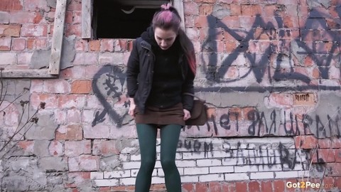 Caucasian girl pulls down her tights for a piss behind an abandoned building | Фото 5