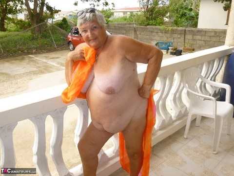 Fat oma Grandma Libby exposes her tan lined body on a balcony | Фото 8