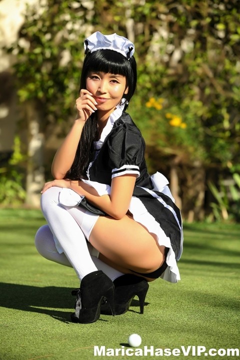 Japanese maid Marica Hase exposes her tits and twat on a putting green | Фото 9