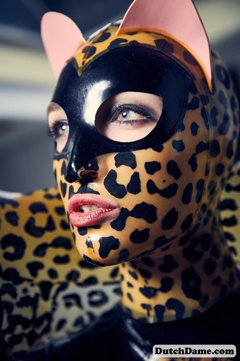 Solo model strikes hot poses in full body leopard print costume