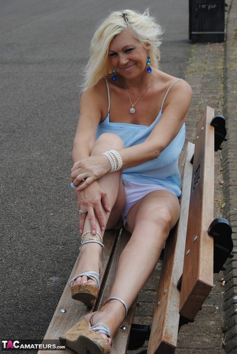 Hot mature Platinum Blonde flashes a hot panty upskirt on a park bench | Фото 18