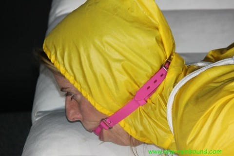 Caucasian chick Pia is ball gagged and hogtied in a yellow rain suit | Фото 8