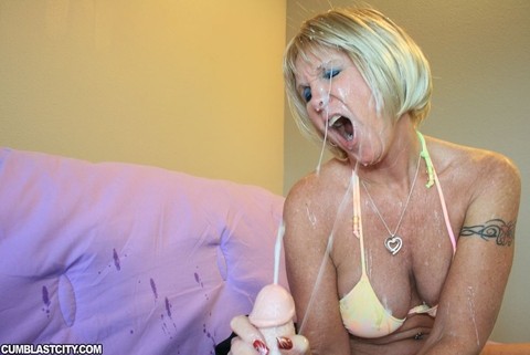 Bikini clad mature woman Honey Ray jerks cock until his face is jizz covered | Фото 11