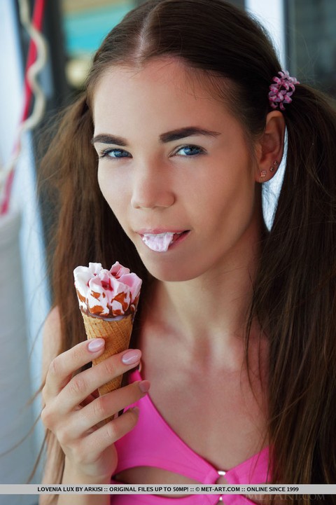 Young looking teen Lovenia Lux eats an ice cream treat before posing naked | Фото 4