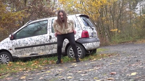 White girl Nicolette Noir takes a piss beside a parked car in a wooded setting | Фото 13