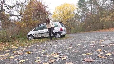 White girl Nicolette Noir takes a piss beside a parked car in a wooded setting | Фото 14